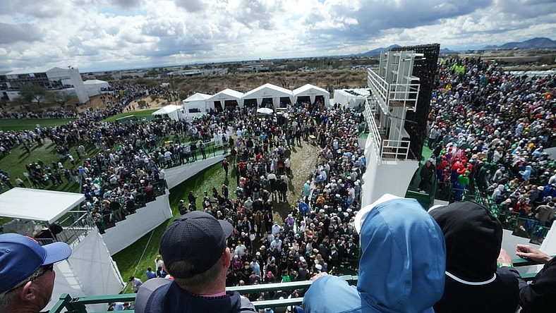 Feb 10, 2024; Scottsdale, AZ, USA; Fans look out from the stands on the 16th hole during the 2024 Phoenix Open at TPC Scottsdale.