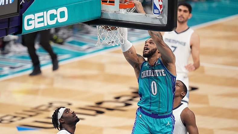 Feb 10, 2024; Charlotte, North Carolina, USA; Charlotte Hornets forward Miles Bridges (0) goes up for a dunk against the Memphis Grizzlies during the second quarter at Spectrum Center. Mandatory Credit: Jim Dedmon-USA TODAY Sports