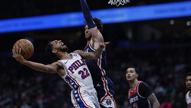 Feb 10, 2024; Washington, District of Columbia, USA; Philadelphia 76ers guard Cameron Payne (22) shoots the ball as Washington Wizards forward Corey Kispert (24) defends in the first half at Capital One Arena. Mandatory Credit: Geoff Burke-USA TODAY Sports