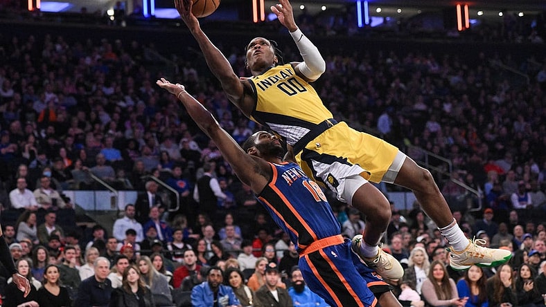 Feb 10, 2024; New York, New York, USA; Indiana Pacers guard Bennedict Mathurin (00) shoots the ball while being defended by New York Knicks guard Alec Burks (18) during the second quarter at Madison Square Garden. Mandatory Credit: John Jones-USA TODAY Sports