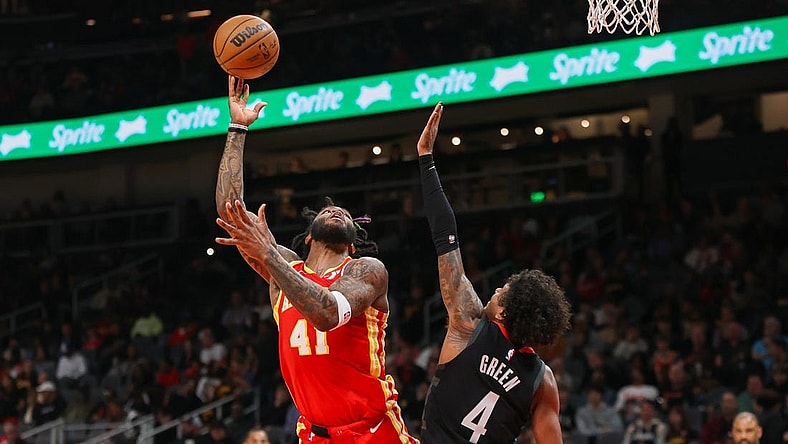 Feb 10, 2024; Atlanta, Georgia, USA; Atlanta Hawks forward Saddiq Bey (41) shoots past Houston Rockets guard Jalen Green (4) in the second quarter at State Farm Arena. Mandatory Credit: Brett Davis-USA TODAY Sports