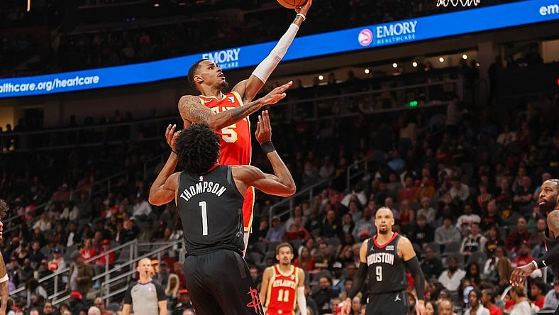 Feb 10, 2024; Atlanta, Georgia, USA; Atlanta Hawks guard Dejounte Murray (5) shoots against the Houston Rockets in the second quarter at State Farm Arena. Mandatory Credit: Brett Davis-USA TODAY Sports