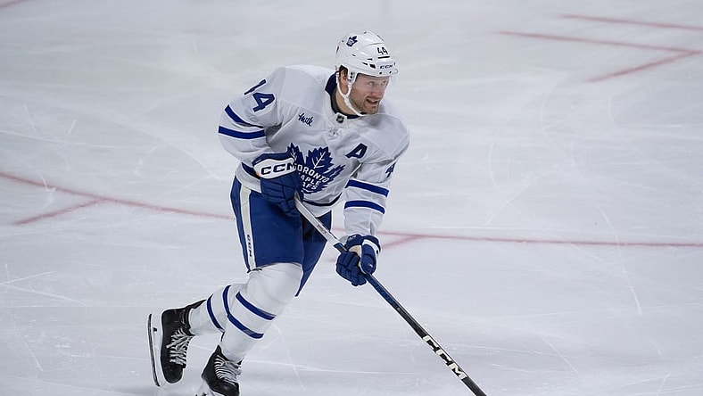 Feb 10, 2024; Ottawa, Ontario, CAN; Toronto Maple Leafs defenseman Morgan Rielly (44) skates with the puck in the third period against the Ottawa Senators at the Canadian Tire Centre. Mandatory Credit: Marc DesRosiers-USA TODAY Sports