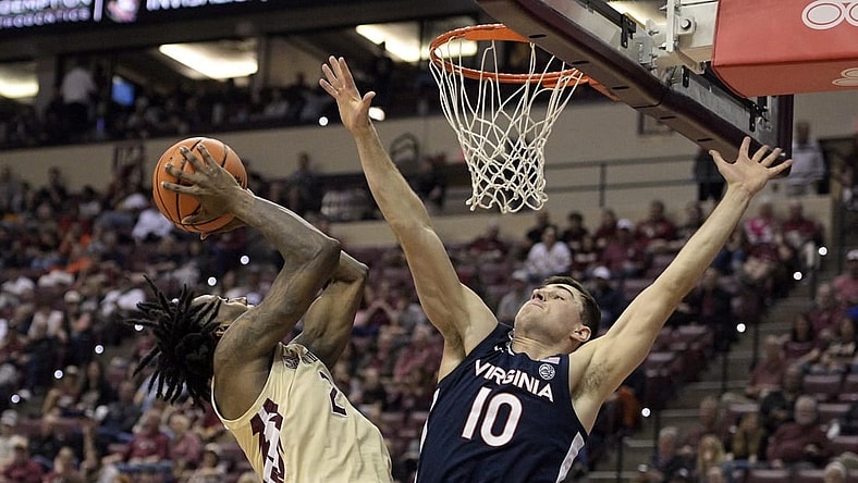 Feb 10, 2024; Tallahassee, Florida, USA; Virginia Cavaliers guard Taine Murray (10) defends the shot of Florida State Seminoles forward Jamir Watkins (2) during the second half at Donald L. Tucker Center. Mandatory Credit: Melina Myers-USA TODAY Sports