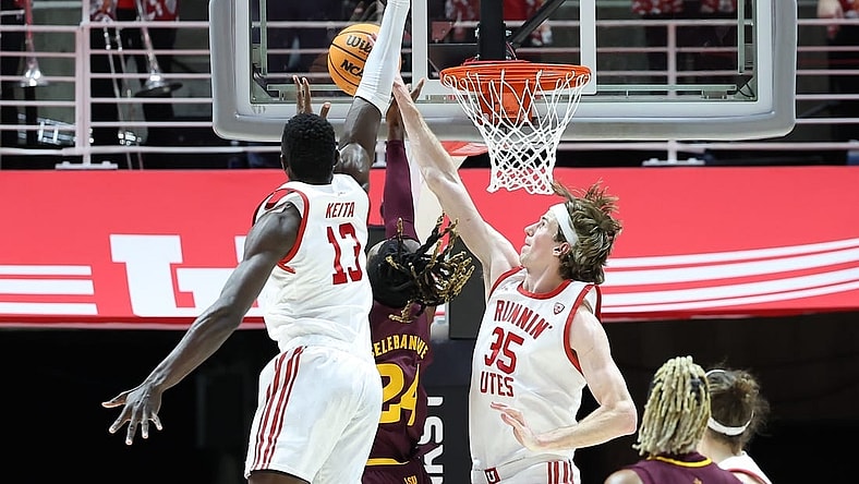 Feb 10, 2024; Salt Lake City, Utah, USA; Utah Utes center Branden Carlson (35) blocks the shot of Arizona State Sun Devils forward Bryant Selebangue (24) during the second half to become the all time Utah Utes shot block leader at Jon M. Huntsman Center. Mandatory Credit: Rob Gray-USA TODAY Sports