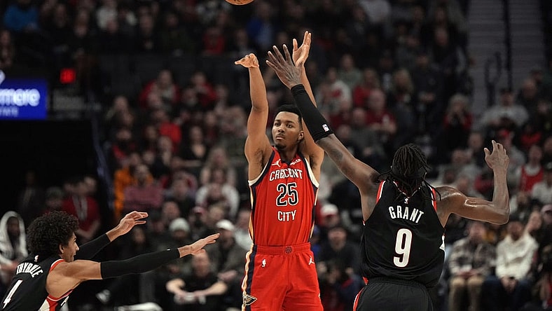 Feb 10, 2024; Portland, Oregon, USA; New Orleans Pelicans shooting guard Trey Murphy III (25) shoots the ball over Portland Trail Blazers small forward Jerami Grant (9) during the first half at Moda Center. Mandatory Credit: Soobum Im-USA TODAY Sports