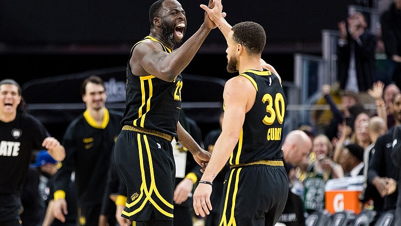 Feb 10, 2024; San Francisco, California, USA; Golden State Warriors center Draymond Green (23) and guard Stephen Curry (30) celebrate after scoring against the Phoenix Suns during the second half at Chase Center. Mandatory Credit: John Hefti-USA TODAY Sports