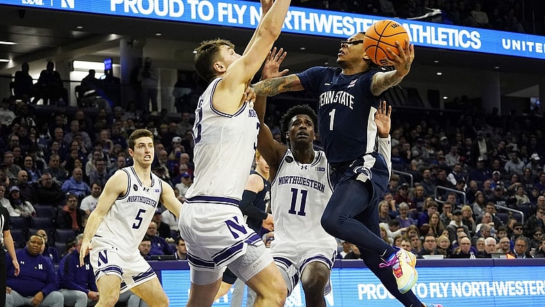 Feb 11, 2024; Evanston, Illinois, USA; Northwestern Wildcats forward Luke Hunger (33) defends Penn State Nittany Lions guard Ace Baldwin Jr. (1) during the first half at Welsh-Ryan Arena. Mandatory Credit: David Banks-USA TODAY Sports