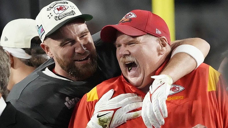Chiefs coach Andy Reid celebrates on the podium with tight end Travis Kelce, left, after Kansas City defeated the Eagles in Super Bowl 57 at State Farm Stadium in Glendale, Arizona on Feb. 12, 2023.