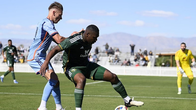 Feb 10, 2024; Indio, CA, USA; Portland Timbers defender Kamal Miller (4) moves the ball while New York City FC forward Hannes Wolf (17) defends at Empire Polo Club. Mandatory Credit: Kelvin Kuo-USA TODAY Sports
