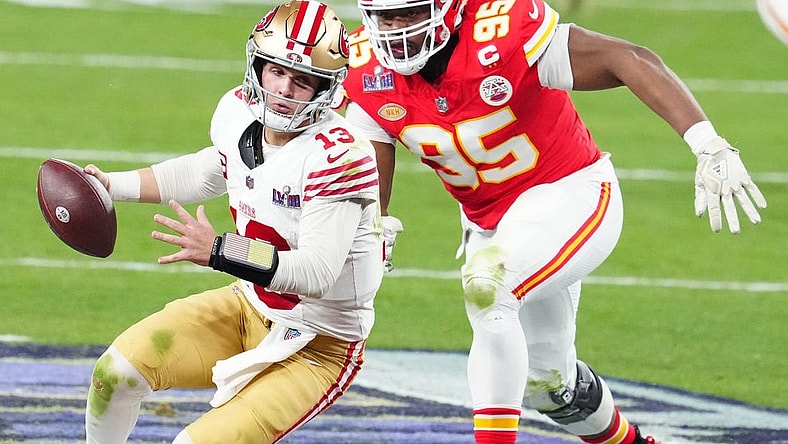Feb 11, 2024; Paradise, Nevada, USA; San Francisco 49ers quarterback Brock Purdy (13) is pressured by Kansas City Chiefs defensive tackle Chris Jones (95) in the second half in Super Bowl LVIII at Allegiant Stadium. Mandatory Credit: Stephen R. Sylvanie-USA TODAY Sports