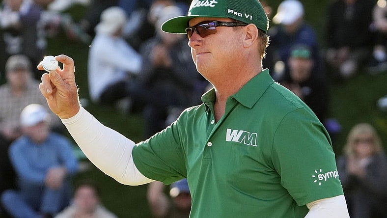 Feb 11, 2024; Scottsdale, AZ, USA; Charley Hoffman finishes with in the lead on the 18th hole during the final round of the WM Phoenix Open at TPC Scottsdale. Mandatory Credit: Rob Schumacher-Arizona Republic