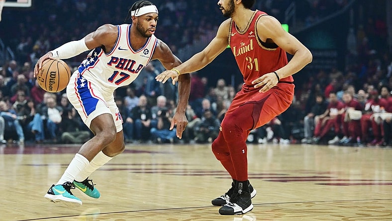 Feb 12, 2024; Cleveland, Ohio, USA; Philadelphia 76ers guard Buddy Hield (17) drives to the basket against Cleveland Cavaliers center Jarrett Allen (31) during the first half at Rocket Mortgage FieldHouse. Mandatory Credit: Ken Blaze-USA TODAY Sports