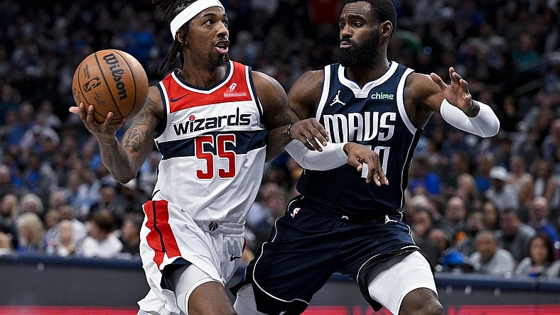 Feb 12, 2024; Dallas, Texas, USA; Washington Wizards guard Delon Wright (55) drives to the basket past Dallas Mavericks forward Tim Hardaway Jr. (10) during the second quarter at the American Airlines Center. Mandatory Credit: Jerome Miron-USA TODAY Sports
