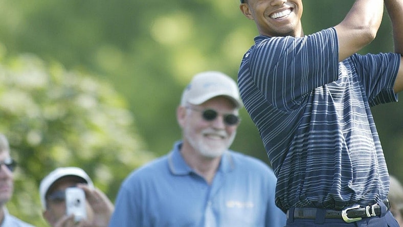 Tiger Woods was all smiles as he prepared to hit on the 13th tee at the Buick Open Pro-Am at Warwick Hills Golf and Country Club in Grand Blanc, Michigan on July 28, 2004.