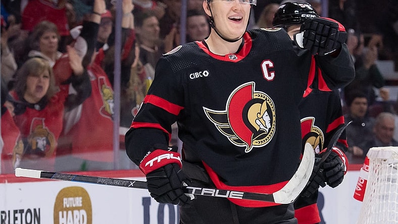 Feb 13, 2024; Ottawa, Ontario, CAN; Ottawa Senators left wing Brady Tkachuk (7) celebrates his goal scored in the first period against the Columbus Blue Jackets at the Canadian Tire Centre. Mandatory Credit: Marc DesRosiers-USA TODAY Sports