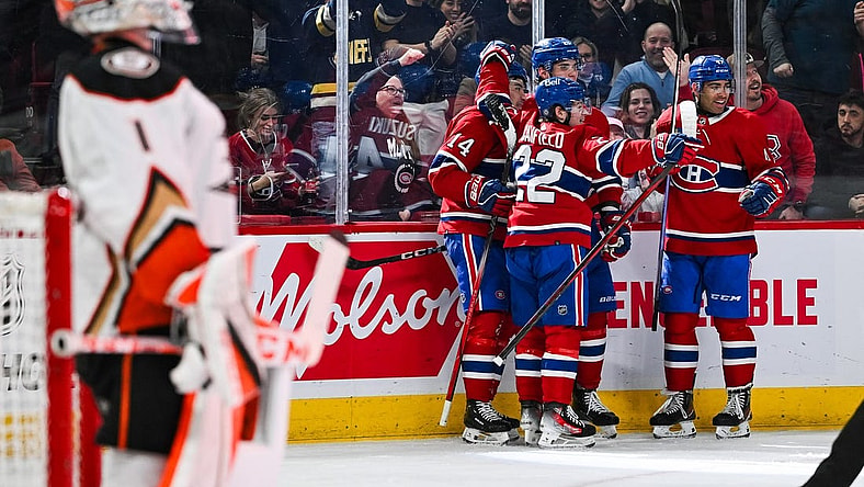 Feb 13, 2024; Montreal, Quebec, CAN; Montreal Canadiens center Nick Suzuki (14) celebrates his first goal of the game against the Anaheim Ducks with his teammates during the second period at Bell Centre. Mandatory Credit: David Kirouac-USA TODAY Sports