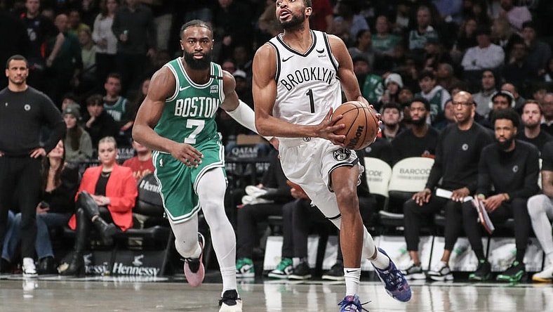 Feb 13, 2024; Brooklyn, New York, USA;  Brooklyn Nets forward Mikal Bridges (1) drives past Boston Celtics guard Jaylen Brown (7) in the third quarter at Barclays Center. Mandatory Credit: Wendell Cruz-USA TODAY Sports