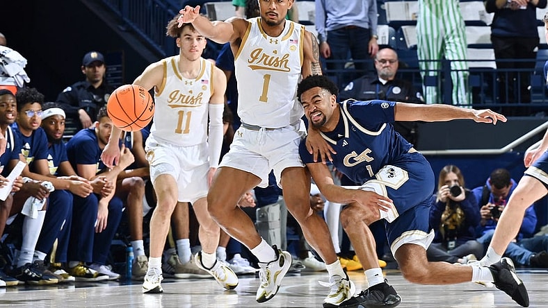 Feb 14, 2024; South Bend, Indiana, USA; Georgia Tech Yellow Jackets guard Kyle Sturdivant (1) knocks the ball away from Notre Dame Fighting Irish guard Julian Roper II (1) in the first half at the Purcell Pavilion. Mandatory Credit: Matt Cashore-USA TODAY Sports