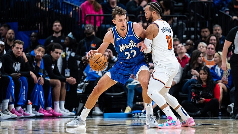 Feb 14, 2024; Orlando, Florida, USA; Orlando Magic forward Franz Wagner (22) dribbles the ball against New York Knicks guard Jalen Brunson (11) in the second quarter at KIA Center. Mandatory Credit: Jeremy Reper-USA TODAY Sports