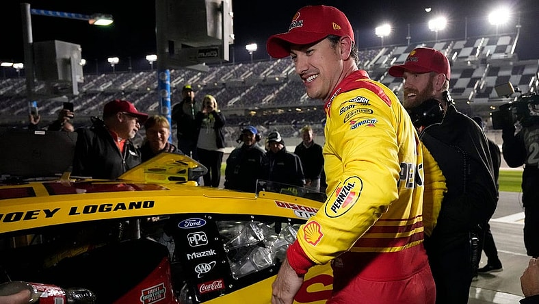 Joey Logano is all smiles after winning the pole for the Daytona 500 during pole qualifying at Daytona International Speedway, Wednesday, Feb. 14, 2024.