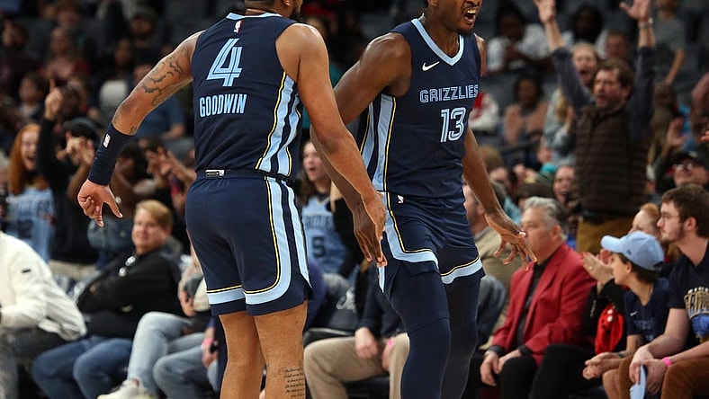 Feb 14, 2024; Memphis, Tennessee, USA; Memphis Grizzlies forward-center Jaren Jackson Jr. (13) reacts with guard Jordan Goodwin(4) after a three-point basket during the second half against the Houston Rockets at FedExForum. Mandatory Credit: Petre Thomas-USA TODAY Sports