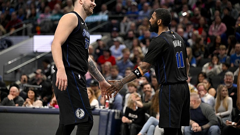 Feb 14, 2024; Dallas, Texas, USA; Dallas Mavericks guard Luka Doncic (77) and guard Kyrie Irving (11) celebrate during the second half against the San Antonio Spurs at the American Airlines Center. Mandatory Credit: Jerome Miron-USA TODAY Sports