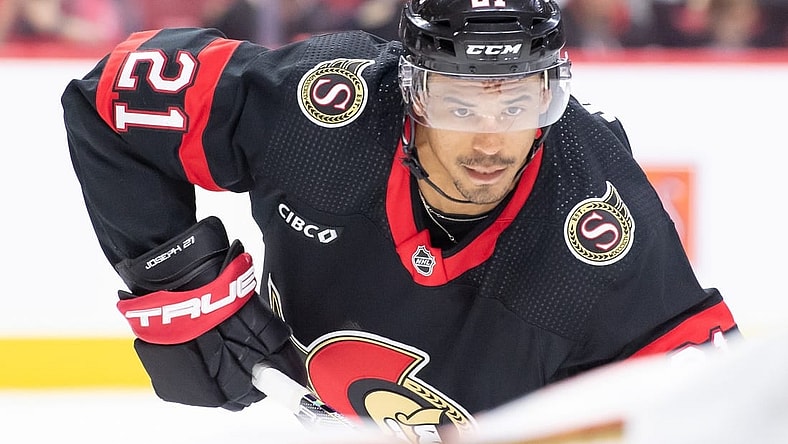 Feb 15, 2024; Ottawa, Ontario, CAN; Ottawa Senators right wing Mathieu Joseph (21) sets up for a face off in the first period  against the Anaheim Ducks at the Canadian Tire Centre. Mandatory Credit: Marc DesRosiers-USA TODAY Sports