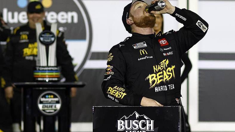 Feb 15, 2024; Daytona Beach, Florida, USA; NASCAR Cup Series driver Tyler Reddick (45) reacts in victory lane after winning the Bluegreen Vacations Duel 1 at Daytona International Speedway. Mandatory Credit: Peter Casey-USA TODAY Sports