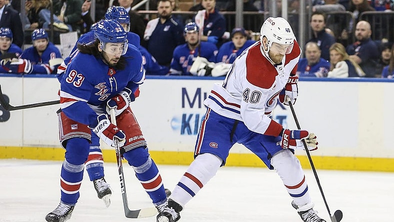 Feb 15, 2024; New York, New York, USA; Montreal Canadiens right wing Joel Armia (40) skates past New York Rangers center Mika Zibanejad (93) on a breakaway in the first period at Madison Square Garden. Mandatory Credit: Wendell Cruz-USA TODAY Sports