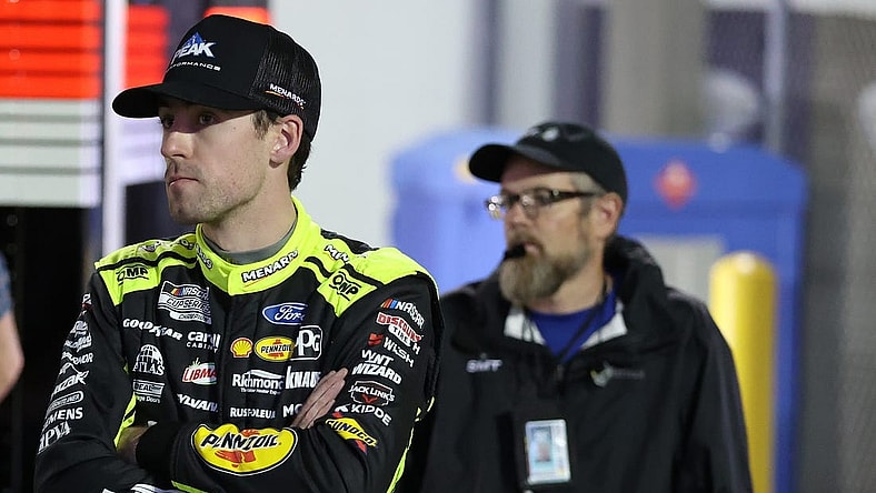 Feb 15, 2024; Daytona Beach, Florida, USA; NASCAR Cup Series driver Ryan Blaney (12) in the garage area after wrecking during the Bluegreen Vacations Duel 2 at Daytona International Speedway. Mandatory Credit: Peter Casey-USA TODAY Sports