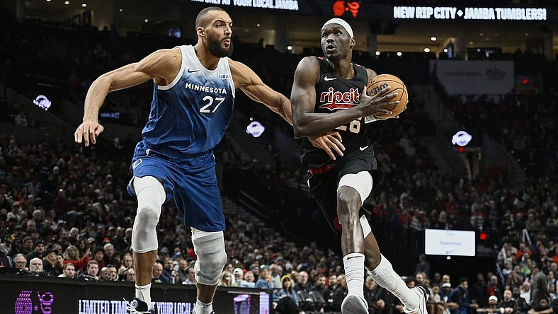 Feb 15, 2024; Portland, Oregon, USA; Portland Trail Blazers center Duop Reath (26) drives to the basket during the second half against Minnesota Timberwolves center Rudy Gobert (27) at Moda Center. Mandatory Credit: Troy Wayrynen-USA TODAY Sports