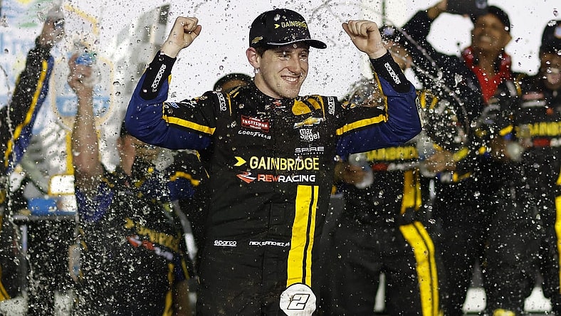 Feb 16, 2024; Daytona Beach, Florida, USA; NASCAR Truck Series driver Nick Sanchez (2) reacts in victory lane after winning the Fresh From Florida 250 at Daytona International Speedway. Mandatory Credit: Peter Casey-USA TODAY Sports