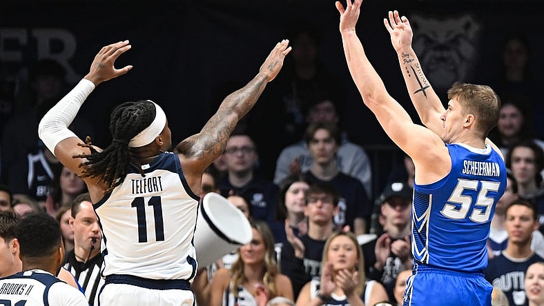Feb 17, 2024; Indianapolis, Indiana, USA;  Creighton Bluejays guard Baylor Scheierman (55) attempts a shot over Butler Bulldogs guard Jahmyl Telfort (11) during the first half at Hinkle Fieldhouse. Mandatory Credit: Robert Goddin-USA TODAY Sports