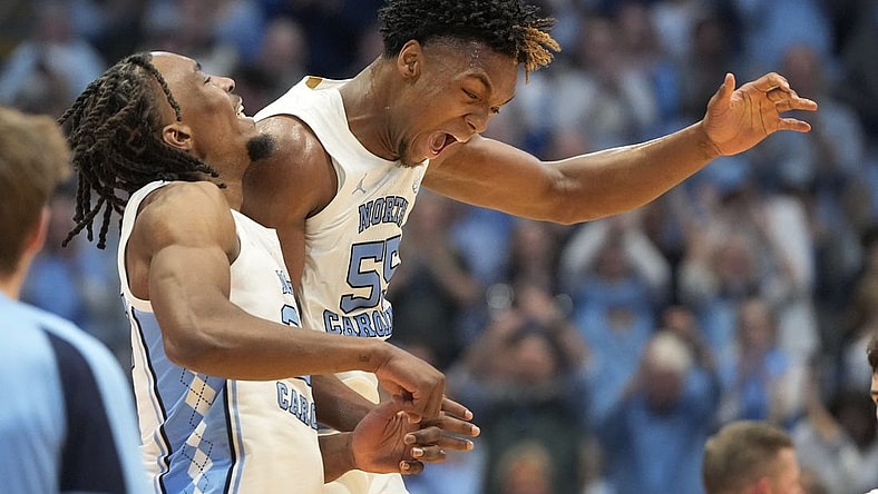 Feb 17, 2024; Chapel Hill, North Carolina, USA; North Carolina Tar Heels forward Harrison Ingram (55) and forward Jae'Lyn Withers (24) celebrate in the first half at Dean E. Smith Center. Mandatory Credit: Bob Donnan-USA TODAY Sports