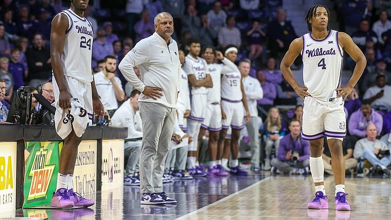 Feb 17, 2024; Manhattan, Kansas, USA; Kansas State Wildcats head coach Jerome Tang, forward Arthur Maluma (24) and guard Dai Dai Ames (4) watch as the TCU Horned Frogs shoots free throws during the second half at Bramlage Coliseum. Mandatory Credit: Scott Sewell-USA TODAY Sports