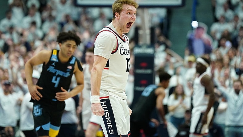 Feb 17, 2024; Hartford, Connecticut, USA; UConn Huskies guard Cam Spencer (12) reacts after a play against the Marquette Golden Eagles in the first half at XL Center. Mandatory Credit: David Butler II-USA TODAY Sports
