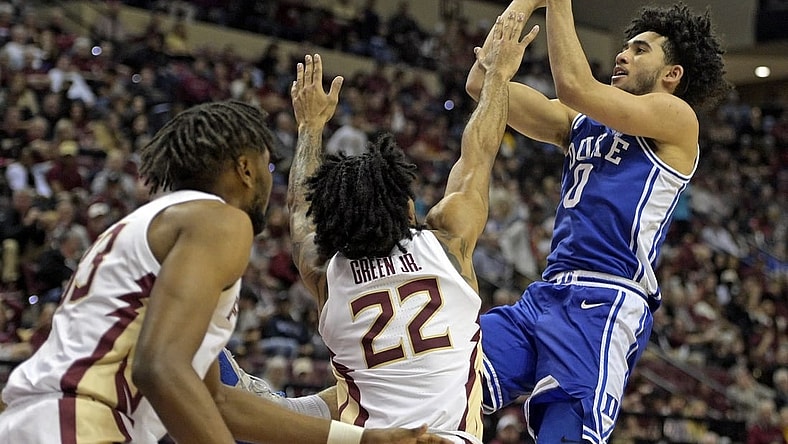 Feb 17, 2024; Tallahassee, Florida, USA; Duke Blue Devils guard Jared McCain (0) shoots the ball over Florida State Seminoles guard Darin Green Jr (22) during the second half at Donald L. Tucker Center. Mandatory Credit: Melina Myers-USA TODAY Sports