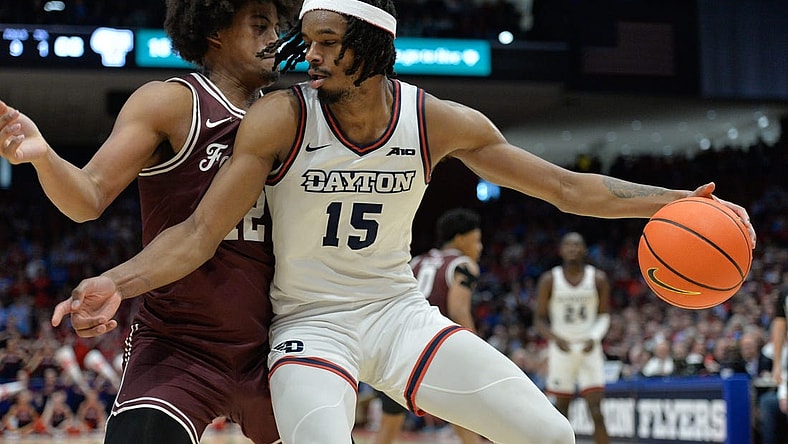 Feb 17, 2024; Dayton, Ohio, USA; Dayton Flyers forward DaRon Holmes II (15) is fouled by Fordham Rams forward Elijah Gray (12) during a game at University of Dayton Arena. Mandatory Credit: Matt Lunsford-USA TODAY Sports