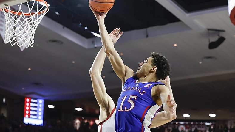 Feb 17, 2024; Norman, Oklahoma, USA; Kansas Jayhawks guard Kevin McCullar Jr. (15) goes to the basket against the Oklahoma Sooners during the first half at Lloyd Noble Center. Mandatory Credit: Alonzo Adams-USA TODAY Sports