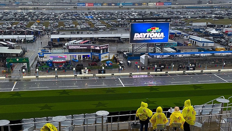 Race fans hope to wait out the rain delay at Daytona International Speedway, Saturday, Feb. 17, 2024.