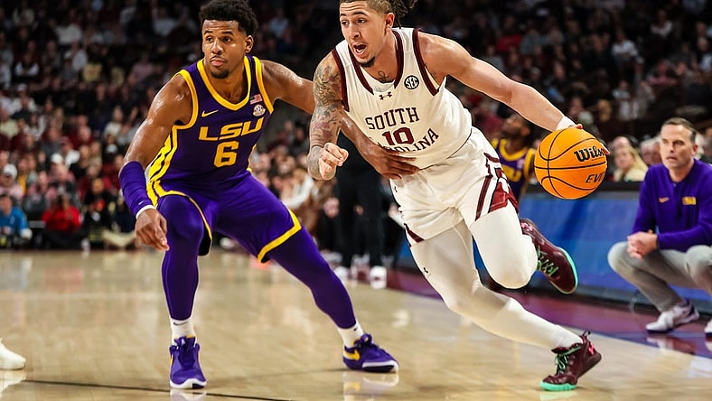 Feb 17, 2024; Columbia, South Carolina, USA; South Carolina Gamecocks guard Myles Stute (10) drives past LSU Tigers guard Jordan Wright (6) in the first half at Colonial Life Arena. Mandatory Credit: Jeff Blake-USA TODAY Sports