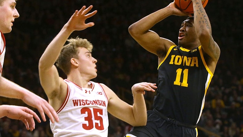 Iowa   s Tony Perkins (11) shoots against Wisconsin Saturday, Feb. 17, 2024 at Carver-Hawkeye Arena in Iowa City, Iowa.