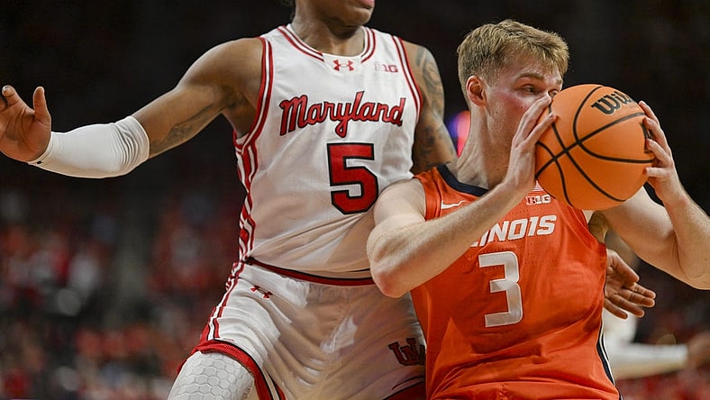 Feb 17, 2024; College Park, Maryland, USA;  Illinois Fighting Illini forward Marcus Domask (3) looks to pass as Maryland Terrapins guard DeShawn Harris-Smith (5) defends during the first  half at Xfinity Center. Mandatory Credit: Tommy Gilligan-USA TODAY Sports