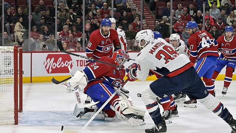 Feb 17, 2024; Montreal, Quebec, CAN; Washington Capitals forward Anthony Mantha (39) scores a goal against Montreal Canadiens goalie Jake Allen (34) during the first period at the Bell Centre. Mandatory Credit: Eric Bolte-USA TODAY Sports