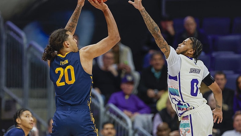 Feb 17, 2024; Seattle, Washington, USA; California Golden Bears guard Jaylon Tyson (20) makes a three-pointer against Washington Huskies guard Koren Johnson (0) during the first half at Alaska Airlines Arena at Hec Edmundson Pavilion. Mandatory Credit: Joe Nicholson-USA TODAY Sports