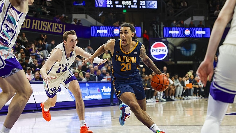Feb 17, 2024; Seattle, Washington, USA; California Golden Bears guard Jaylon Tyson (20) dribbles past Washington Huskies forward Moses Wood (13) during the first half at Alaska Airlines Arena at Hec Edmundson Pavilion. Mandatory Credit: Joe Nicholson-USA TODAY Sports