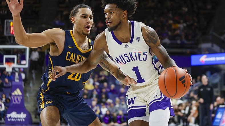 Feb 17, 2024; Seattle, Washington, USA; Washington Huskies forward Keion Brooks Jr. (1) dribbles against California Golden Bears guard Jaylon Tyson (20) during the first half at Alaska Airlines Arena at Hec Edmundson Pavilion. Mandatory Credit: Joe Nicholson-USA TODAY Sports