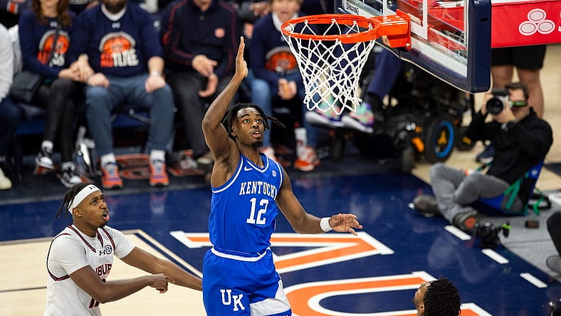 Kentucky Wildcats guard Antonio Reeves (12) goes up for a layup as Auburn Tigers take on Kentucky Wildcats at Neville Arena in Auburn, Ala., on Saturday, Feb. 17, 2024. Kentucky Wildcats defeated Auburn Tigers 70-59.
