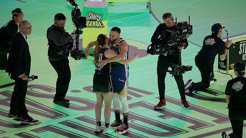 Feb 17, 2024; Indianapolis, IN, USA; Golden State Warriors guard Stephen Curry (30) competes in the Stephen vs. Sabrina 3-Point Challenge against New York Liberty guard Sabrina Ionescu (20) during NBA All Star Saturday Night at Lucas Oil Stadium. Mandatory Credit: Trevor Ruszkowski-USA TODAY Sports